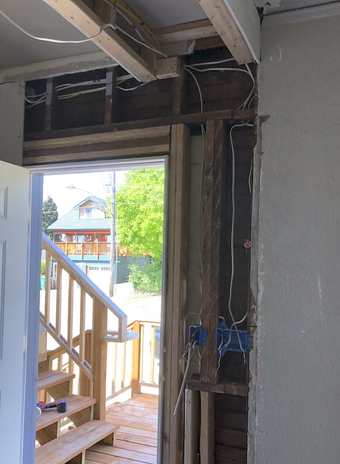 open wall showing electrical wires